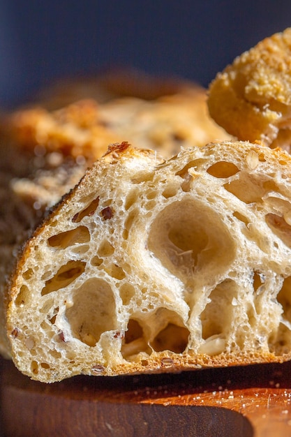 Bread macro. Bread pores. Fresh baguette with grains macro.Bakery advertisement. Seeds in bread.