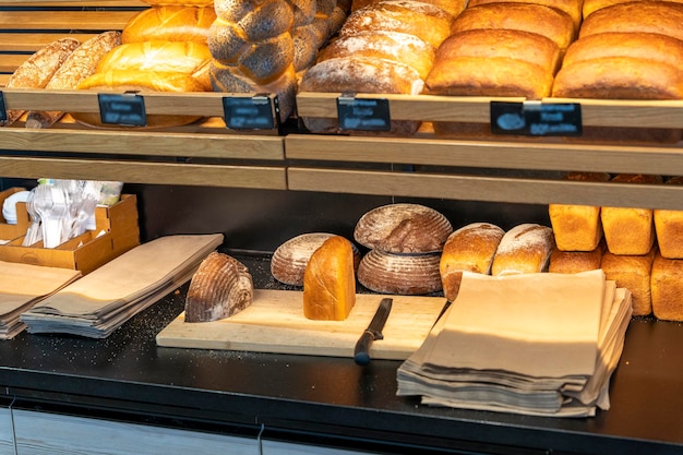 Bread and rolls on the shelves of the bread shop