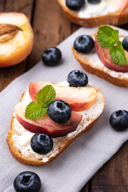 bread toast with peach and blue berry