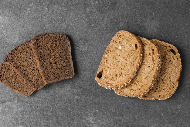 Bread traditional sourdough bread cut into slices on a rustic wooden background