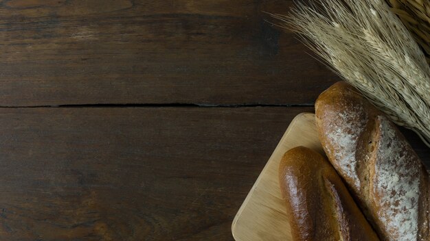 Bread  Wheat oats on wood  image background.