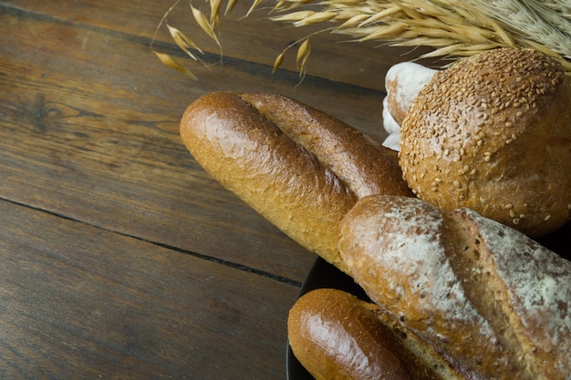 Bread  Wheat oats on wood  image background.