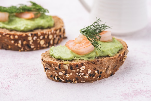 Bread wholegrain mashed avocado with shrimp