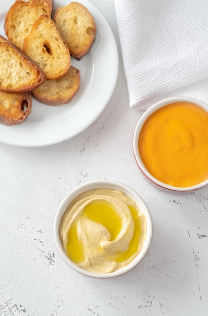 Bread with cheddar sauce and hummus