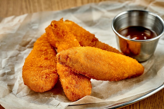 Breaded chicken nuggets A selective trick Closeup Noise added in postproduction