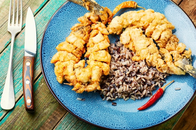 Breaded fish and boiled rice