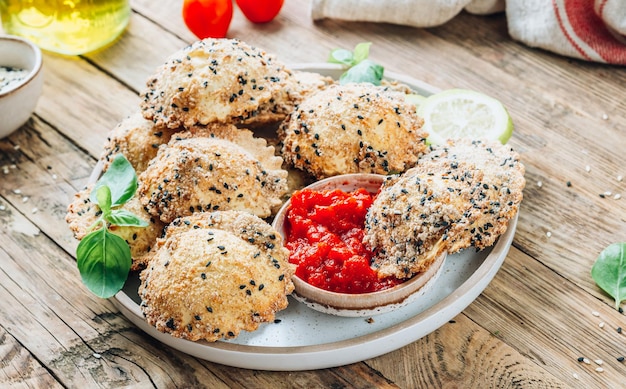 Breaded fried Italian ravioli with marinara dip