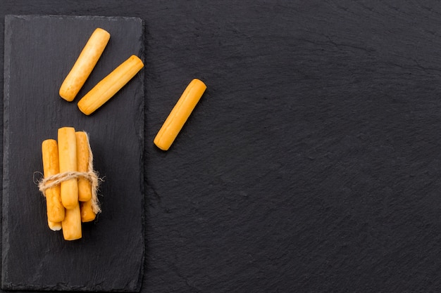 Breadsticks isolated on black background