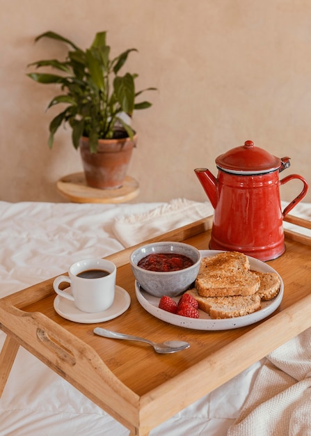 Breakfast in bed with coffee and jam