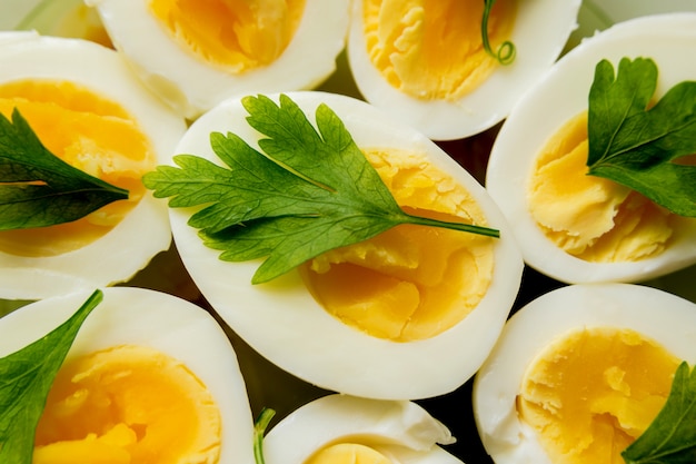 Breakfast. Boiled eggs with parsley. Food background.