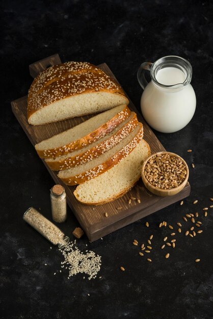 Breakfast bread with milk on cutting board