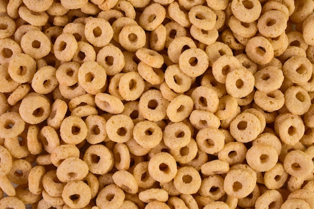 Breakfast cereal. Cereal rings with honey background.