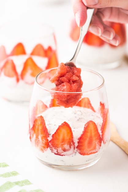 Breakfast of Greek Yogurt Glass with chia and strawberries.