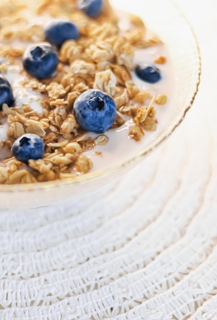 Breakfast idea and delicious food breakfast cereal grains with lactosefree yoghurt and fresh organic blueberries in a bowl tasty and healthy recipe