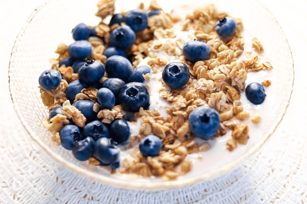 Breakfast idea and delicious food breakfast cereal grains with lactosefree yoghurt and fresh organic blueberries in a bowl tasty and healthy recipe