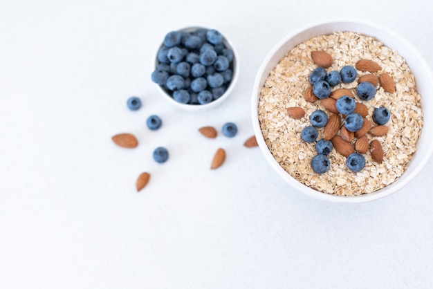 Breakfast: oatmeal with bananas, blueberries, chia seeds and almonds. Top view