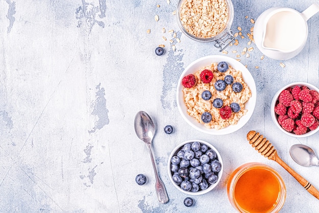 Breakfast, oatmeal with berries, top view.