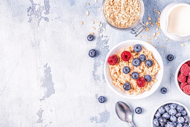 Breakfast, oatmeal with berries, top view.