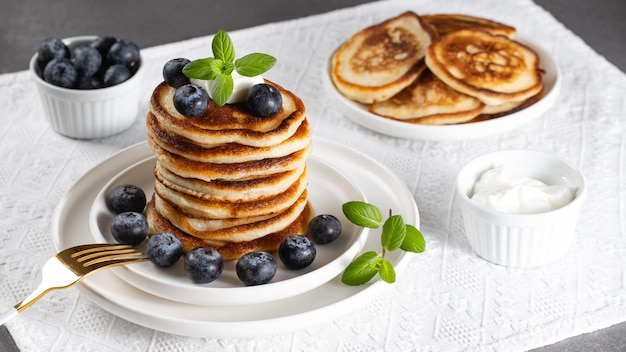 Breakfast pancakes with blueberries and sour cream