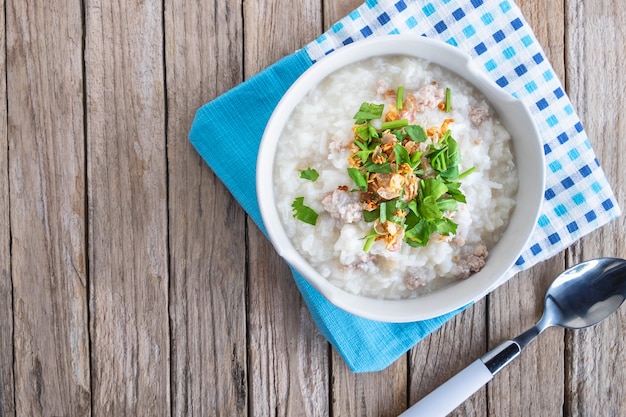 Breakfast rice porridge on wood table