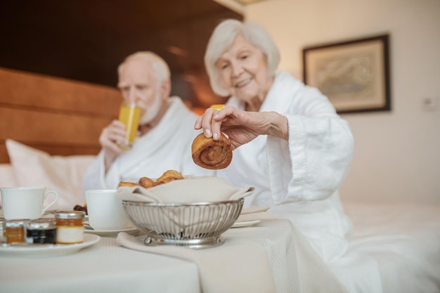 Breakfast. Senior couple enjoying their breakfast in a hotel