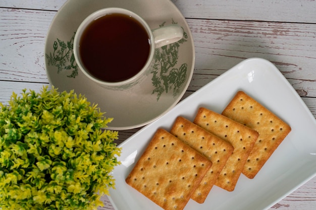 Breakfast serving of cream crackers and a cup of tea