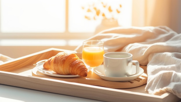 Breakfast tray with orange juice croissants and milk in the room