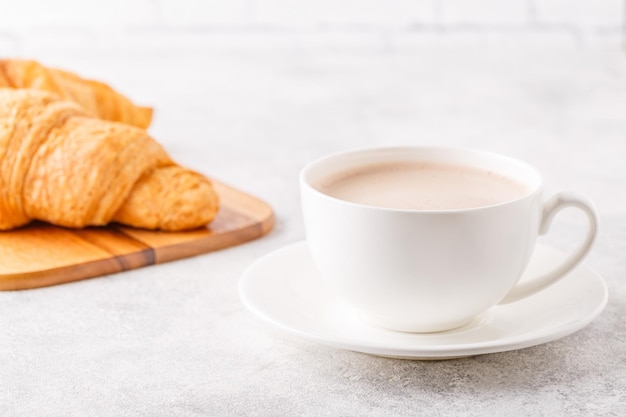 Breakfast with coffee and croissants