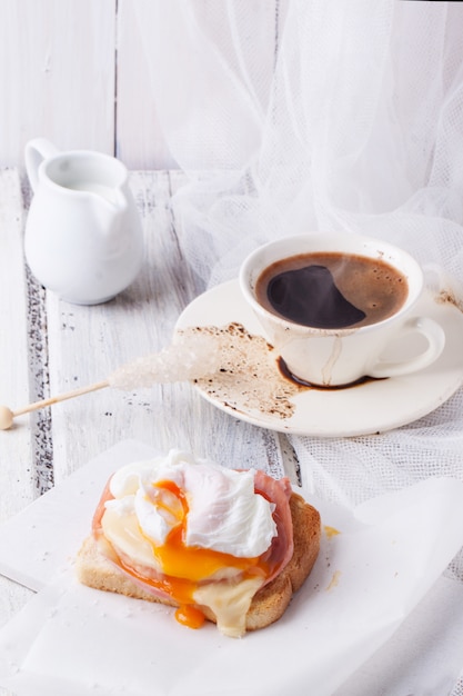 Breakfast with coffee and toast with cheese and egg