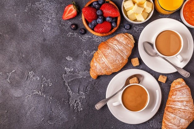 Breakfast with fresh croissants and coffee