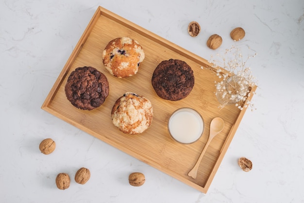 Breakfast with fresh homemade delicious muffins and milk.