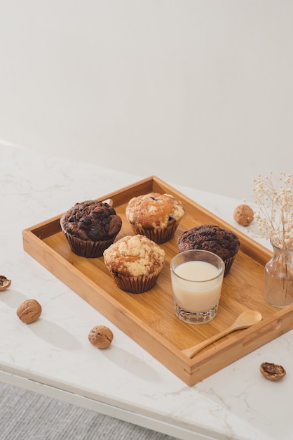 Breakfast with fresh homemade delicious muffins and milk.