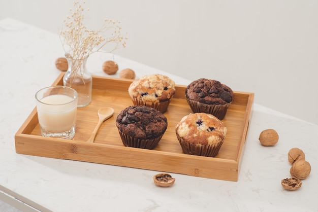 Breakfast with fresh homemade delicious muffins and milk.