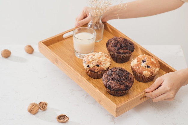 Breakfast with fresh homemade delicious muffins and milk.