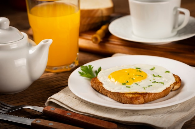 Breakfast with juice coffee and toast with fried egg