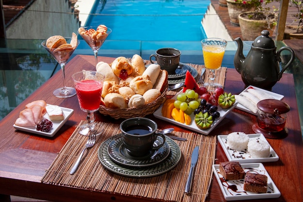 Breakfast with orange juice and assorted breads