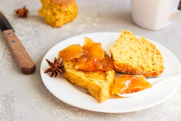 Breakfast with spicy pumpkin scones, a cup of tea and milk.