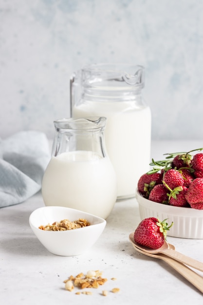 Breakfast with yogurt, granola and fresh strawberry in a mason jar 