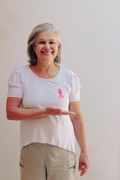 Breast Cancer Awareness Month image Mature White Woman With pink ribbon isolated