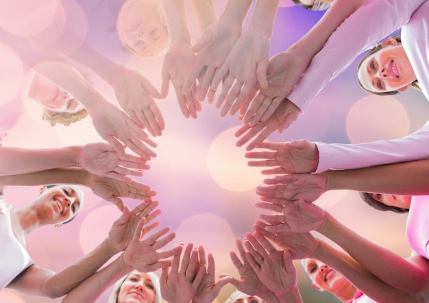 Breast cancer awareness women putting hands together