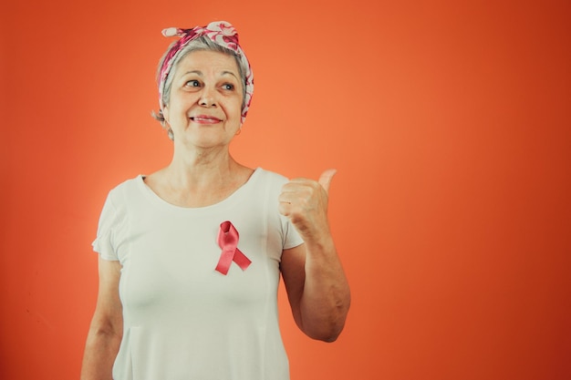 Breast Cancer Protection Symbol Mature Woman With Pink Ribbon on and White t shirt isolated for breast cancer campaign