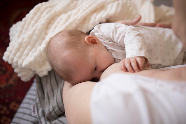 Breastfeeding baby happy mom and baby at home