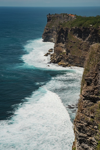 Breathtaking landscape of mighty ocean waves breaking against rocky shore stock photo