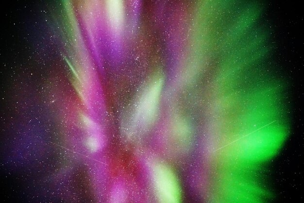 Photo breathtaking view of aurora borealis in the starry sky in kvaloya arctic region in norway