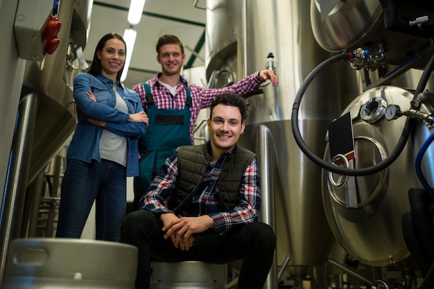 Brewers posing at brewery factory