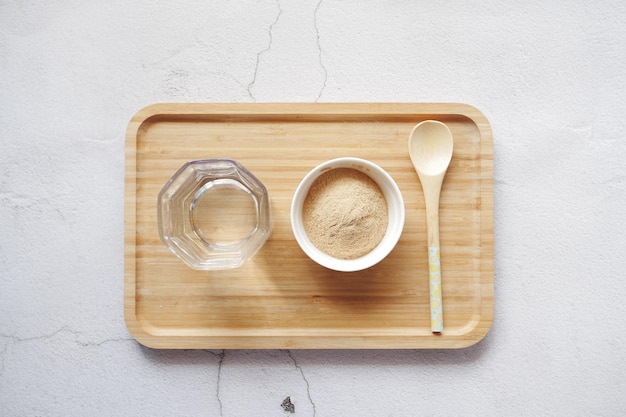 Brewers yeast flakes in a bowl on table