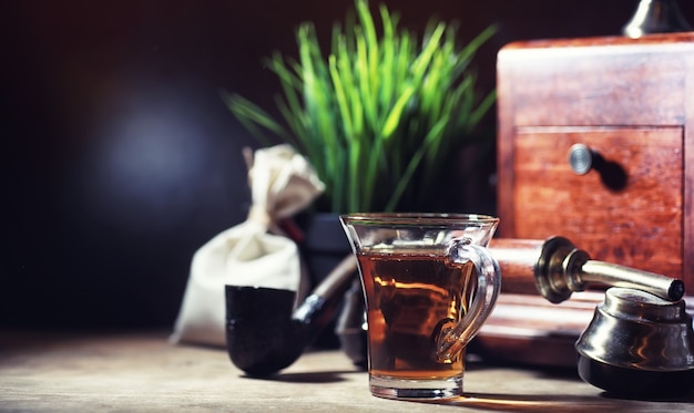 Brewing tea on a wooden table in the morning