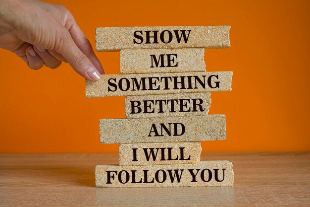 Brick blocks with text Show me something better and i will follow you Beautiful orange background