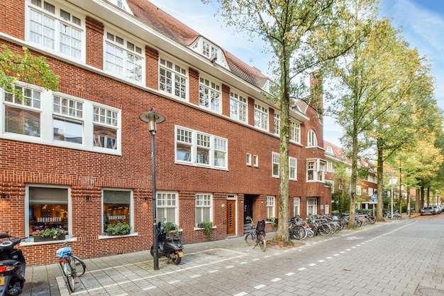 A brick building with bikes parked in front of it