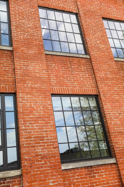 A brick building with a window that says " the word " on it "